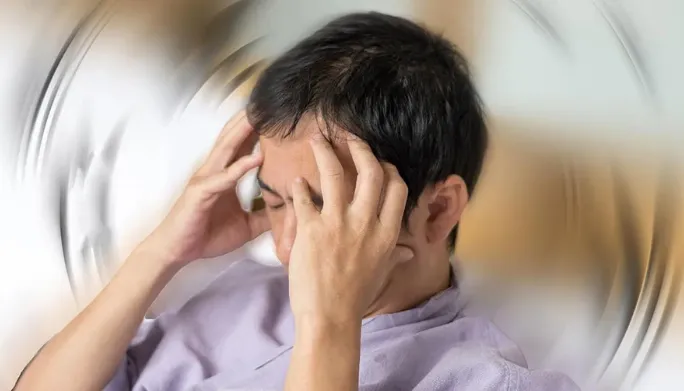 Physical therapist assessing a patient's vestibular system and dizziness